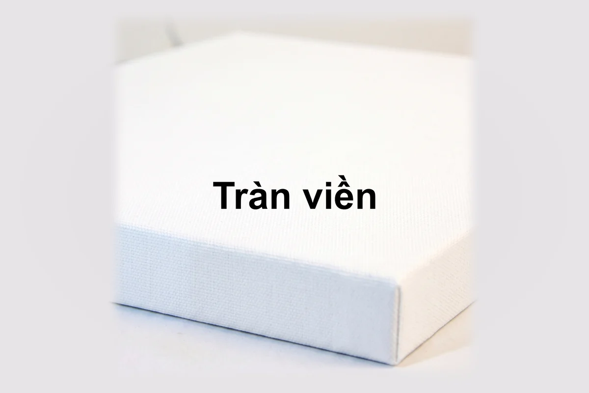 Cận cảnh cạnh khung tranh tràn viền màu trắng.