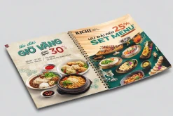 Menu món ăn đóng lò xo đặt mở, một trang uốn cong khi lật.